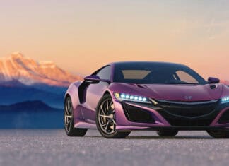 A purple Honda Nsx is parked on a flat surface with mountains glowing at sunset in the background, 2K Desktop Wallpaper