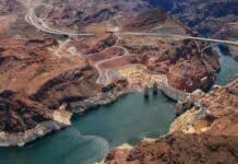 The Hoover Dam stretches across the river in a rocky desert terrain, 4K Desktop Wallpaper