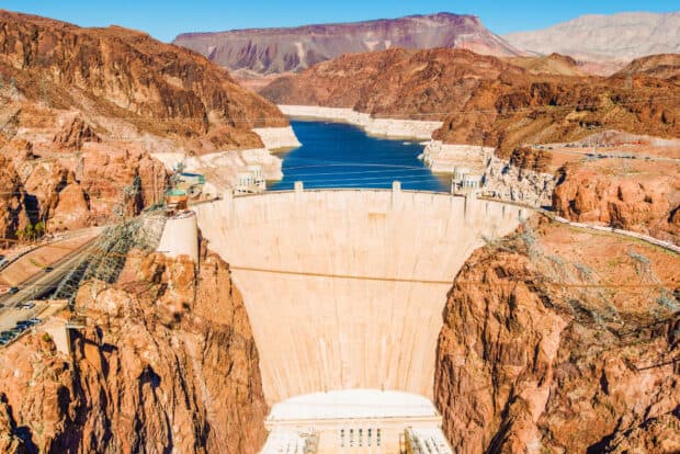 Hoover Dam stands tall over Lake Mead surrounded by red rocky mountains, HD Desktop Wallpaper