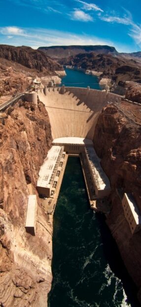 The Hoover Dam and Lake Mead are seen surrounded by rocky mountains, HD Phone Wallpaper