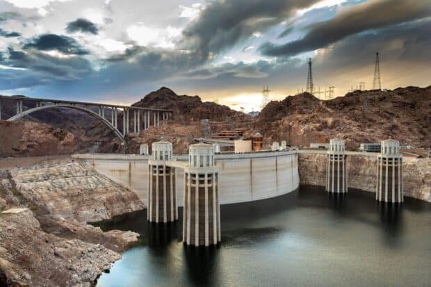 Hoover Dam is surrounded by rocky terrain and a large reservoir, HD Desktop Wallpaper