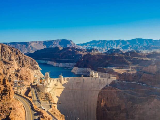 The Hoover Dam stands tall between rocky cliffs and a blue reservoir, HD Desktop Wallpaper