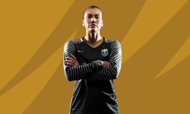 Hope Solo stands with arms crossed in team uniform, HD Desktop Wallpaper