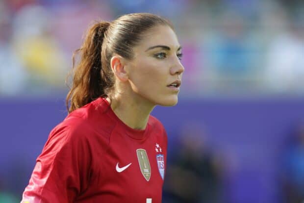 Hope Solo focused during the match wearing a red jersey, 2K Desktop Wallpaper