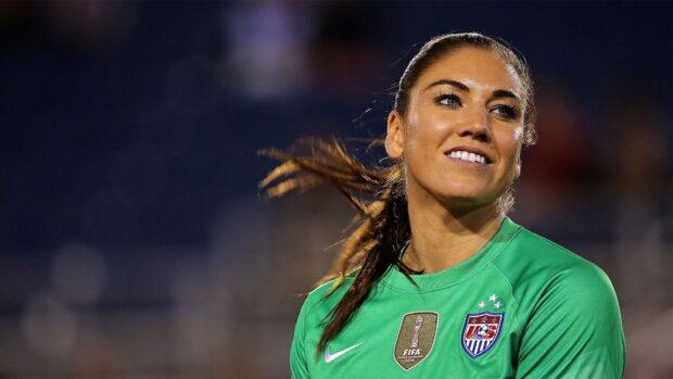 Hope Solo smiles confidently during a match wearing the US team jersey, HD Desktop Wallpaper