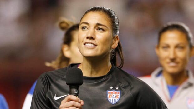 Hope Solo giving a speech while wearing a US soccer jersey, HD Desktop Wallpaper