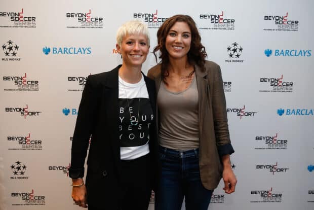 Hope Solo with a friend smiling at the Beyond Soccer Series event, 2K Desktop Wallpaper