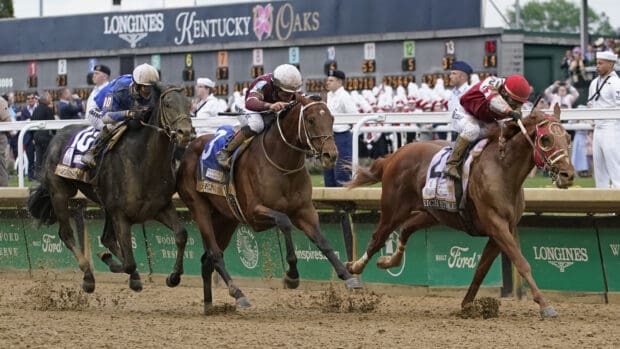 Jockeys compete fiercely in horse racing with horses speeding at the track, 2K Desktop Wallpaper