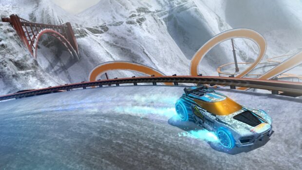 A Hot Wheels car racing on a snowy, icy track with glowing blue tires and winding orange loops in the background, HD Desktop Wallpaper