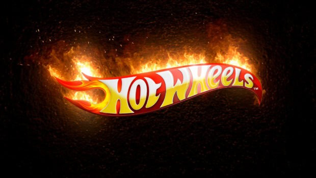The Hot Wheels logo is shown with bright flames on a dark surface, HD Desktop Wallpaper