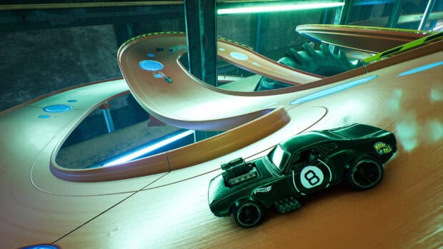 A Hot Wheels car speeds on a winding racing track indoors, HD Desktop Wallpaper