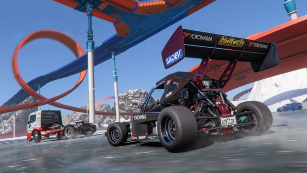 Hot Wheels racing cars drifting on a mountain track with loops, 4K Desktop Wallpaper