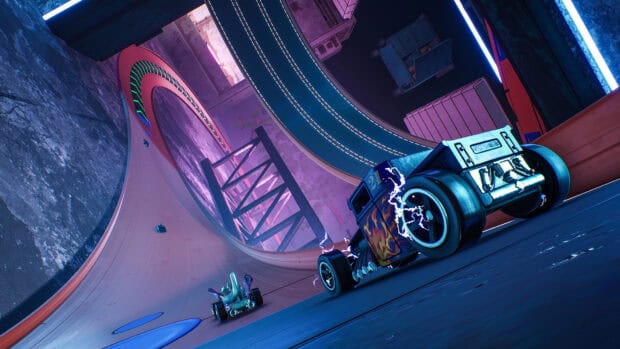 A Hot Wheels car races through a glowing indoor track with sharp turns and vibrant lights, HD Desktop Wallpaper