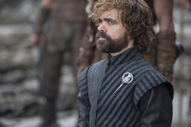 A man wearing a dark outfit with a Hand of the King pin from House Lannister, 2K Desktop Wallpaper