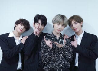 Huening Kai is holding an MGMA trophy with three friends smiling, HD Desktop Wallpaper