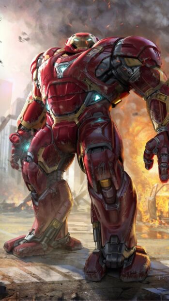 The Hulkbuster powerful mech suit stands amid a chaotic city battle scene, 2K Mobile Wallpaper