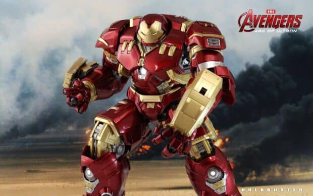 The Hulkbuster stands ready for combat among fiery explosions and smoke, HD Desktop Wallpaper