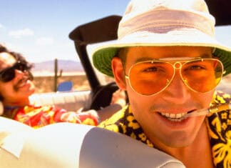 A close up of Hunter S Thompson wearing yellow glasses and a hat on a desert road trip, HD Desktop Wallpaper