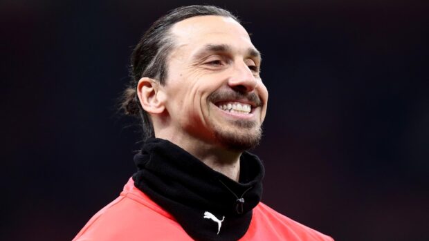 Zlatan Ibrahimovic smiles during a football event wearing a Puma outfit, 2K Desktop Wallpaper