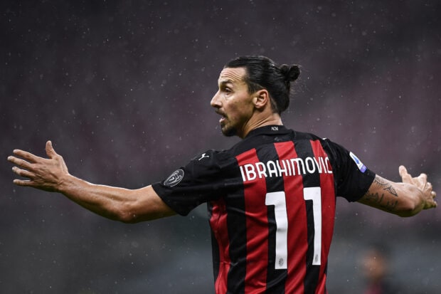 Zlatan Ibrahimovic stretches his arms wide during a rainy match, HD Desktop Wallpaper