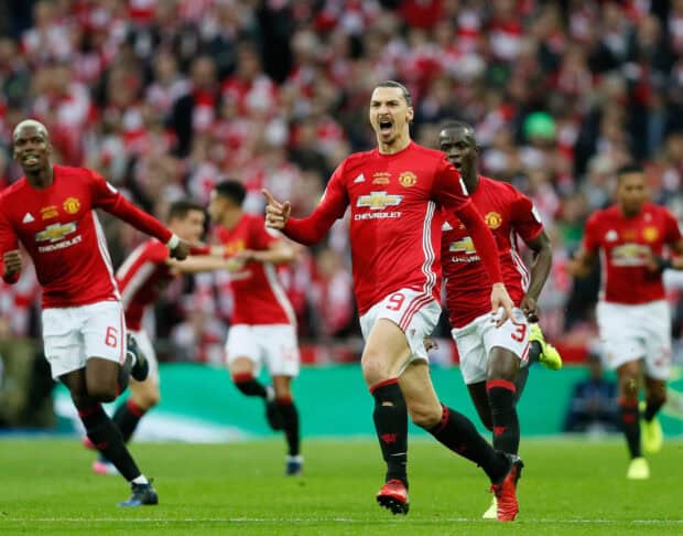Zlatan Ibrahimovic celebrates a goal with teammates on the football field, HD Desktop Wallpaper