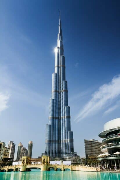 The Burj Khalifa stands tall among city buildings under a clear sky in the United Arab Emirates, 2K Mobile Wallpaper