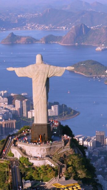 The Christ the Redeemer statue overlooks the city and bay in Rio De Janeiro Wallpapers, HD Mobile Wallpaper