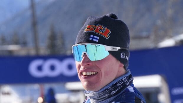Iivo Niskanen wears reflective goggles and a winter hat during a snowy outdoor event, HD Desktop Wallpaper