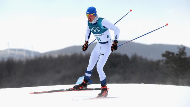 Iivo Niskanen competing in cross country skiing during a race on snow, 2K Desktop Wallpaper