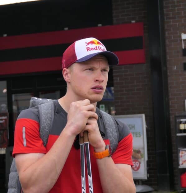 Iivo Niskanen is holding ski poles and looking focused in this image, HD Mobile Wallpaper