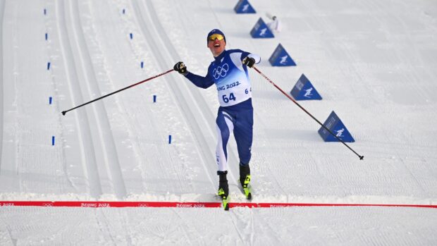 Iivo Niskanen celebrates crossing the finish line at the Winter Olympics, 2K Desktop Wallpaper