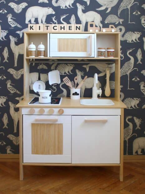 A wooden Ikea kitchen set with utensils and animal wallpaper background, HD Mobile Wallpaper