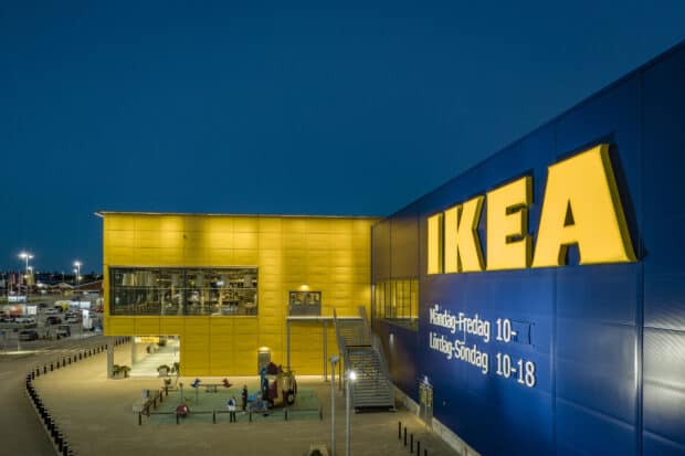 The Ikea store exterior is brightly lit under a dark blue sky showing the building's yellow and blue colors, HD Desktop Wallpaper