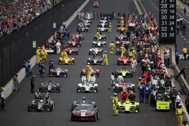 IndyCar cars lined up on the starting grid at Indianapolis Motor Speedway, 2K Desktop Wallpaper