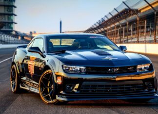 A sleek black car with Indianapolis Motor Speedway logo parked on the racetrack, HD Desktop Wallpaper