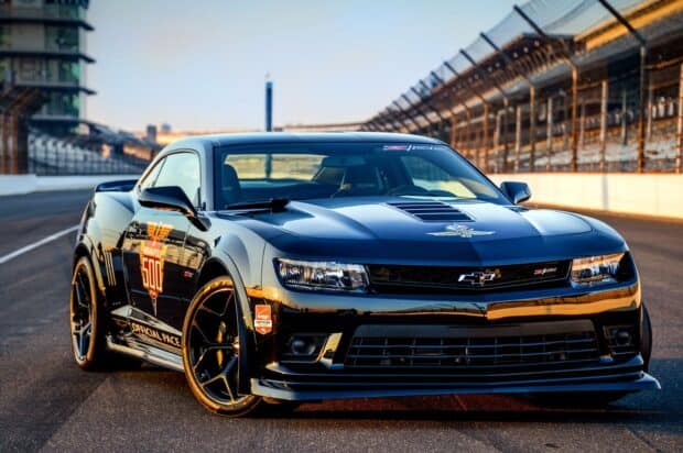 A sleek black car with Indianapolis Motor Speedway logo parked on the racetrack, HD Desktop Wallpaper