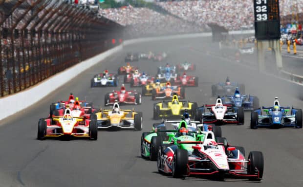 A close up of IndyCar race cars competing at Indianapolis Motor Speedway, HD Desktop Wallpaper