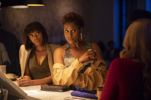 Two women engage in a tense conversation at a bar in Insecure TV Series, 2K Desktop Wallpaper