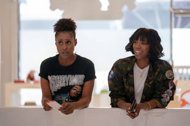 Two women share a candid moment in a scene from Insecure Tv Series, 2K Desktop Wallpaper
