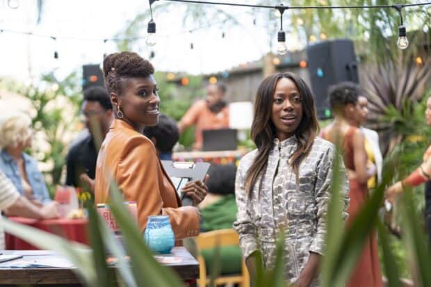 Two women from Insecure tv series talking at a party outdoors, HD Desktop Wallpaper
