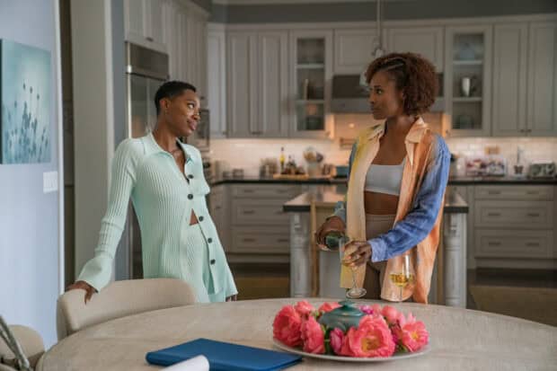 Two women from Insecure TV series talking in a kitchen, HD Desktop Wallpaper