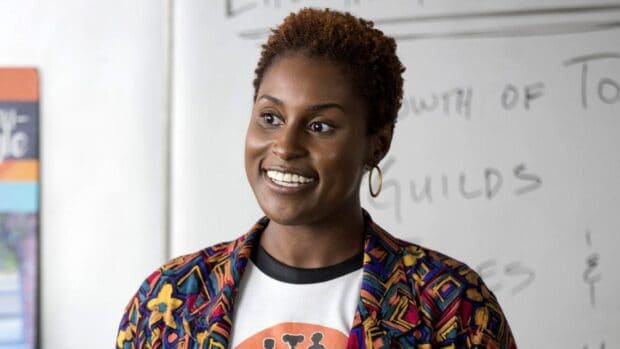 A woman smiles warmly in a classroom from Insecure Tv Series wallpapers, HD Desktop Wallpaper