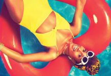 A woman in a yellow swimsuit relaxes on a red float in the pool for Insecure Tv Series, 4K Desktop Wallpaper