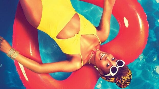 A woman in a yellow swimsuit relaxes on a red float in the pool for Insecure Tv Series, 4K Desktop Wallpaper