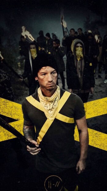 Josh Dun stands determined with a yellow bandana and tape while people hold torches behind him, HD Mobile Wallpaper