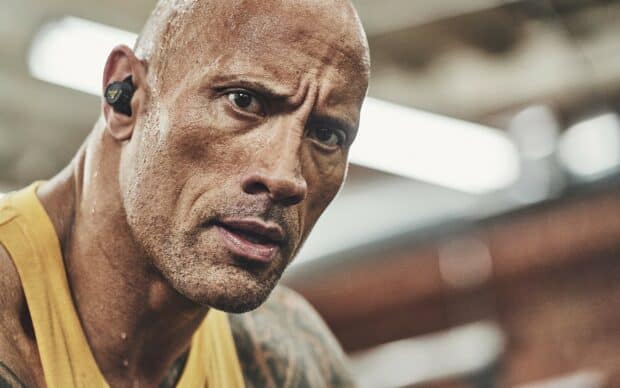 A detailed close up of Dwayne Johnson showing his focused expression during a workout session, 2K Desktop Wallpaper