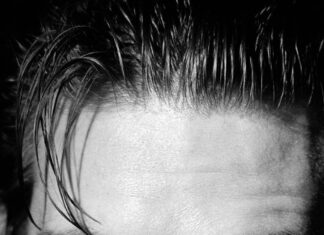 A black and white close up portrait showing Ralph Fiennes with a serious expression, HD Phone Wallpaper