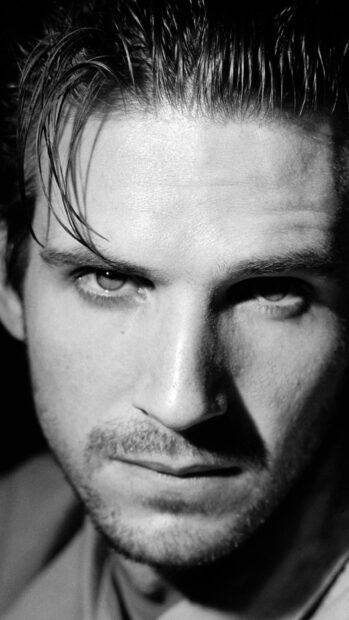 A black and white close up portrait showing Ralph Fiennes with a serious expression, HD Phone Wallpaper