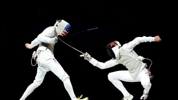 Two fencers compete fiercely in a close match, HD Desktop Wallpaper