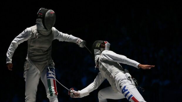 Two fencers engage in a fast paced fencing bout, HD Desktop Wallpaper